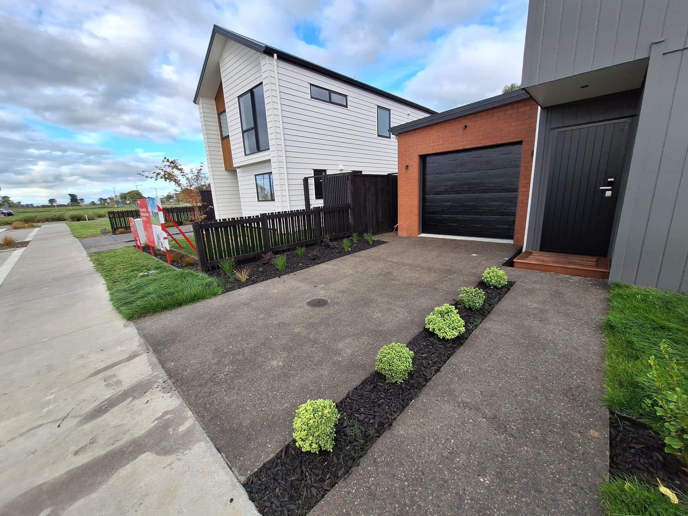 New driveway edged with low-maintenance planting