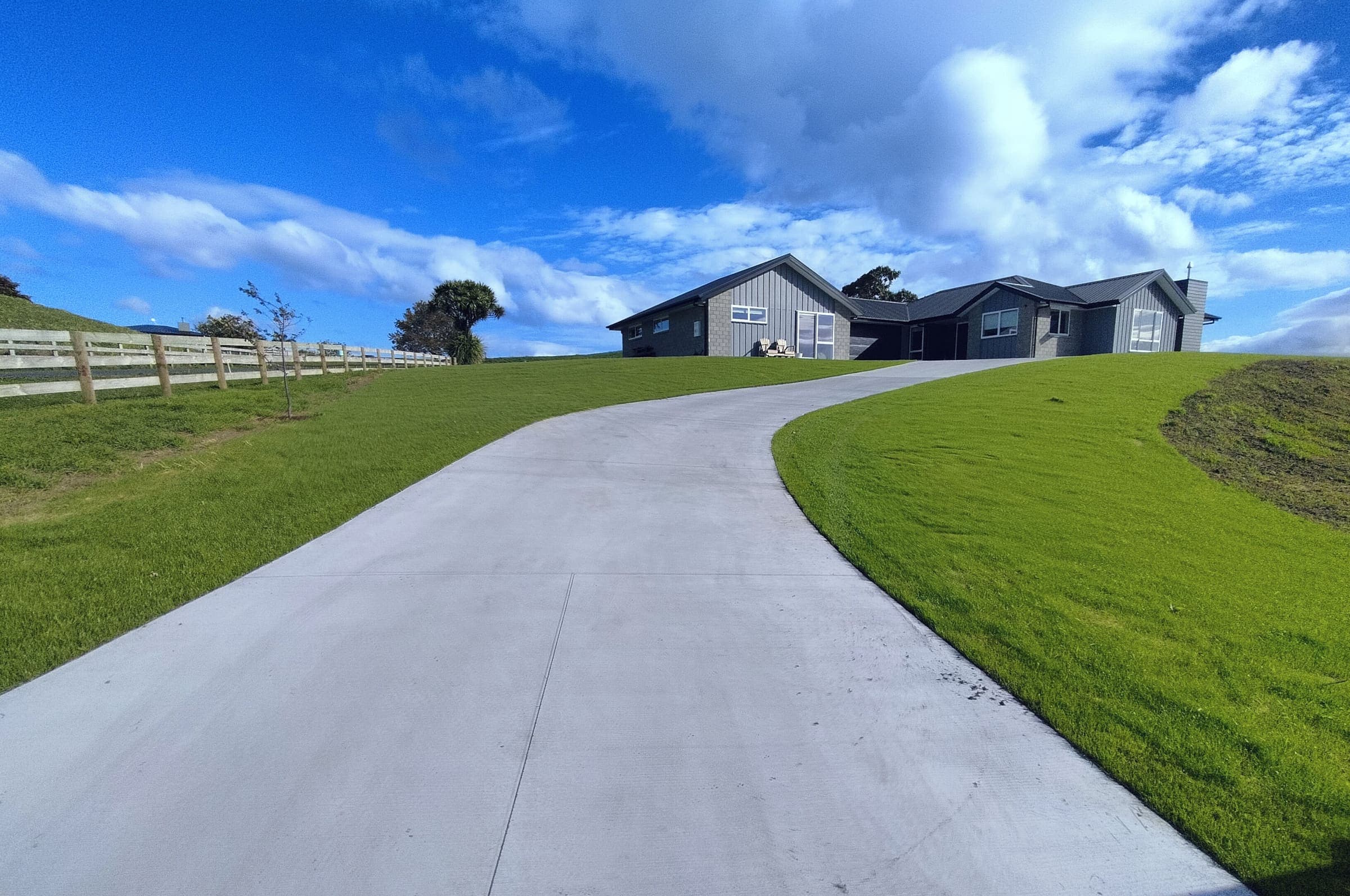 Exposed aggregate concrete driveway installed by Tensen Landscapes in Hamilton
