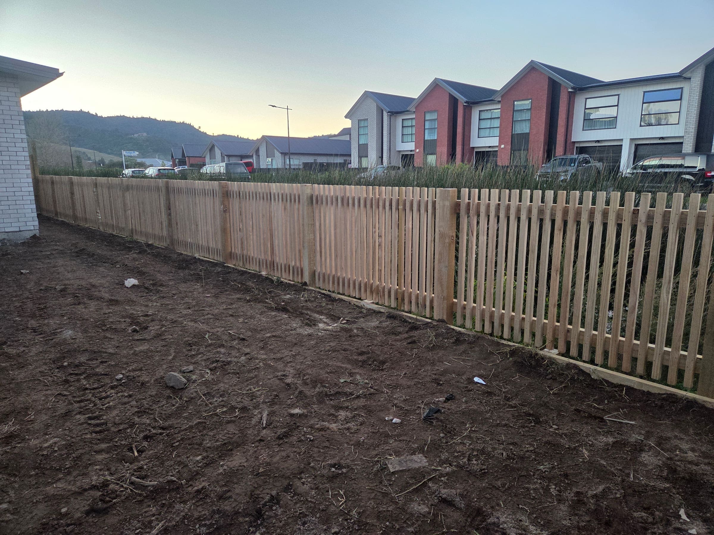 Timber picket fence installed on a new build section
