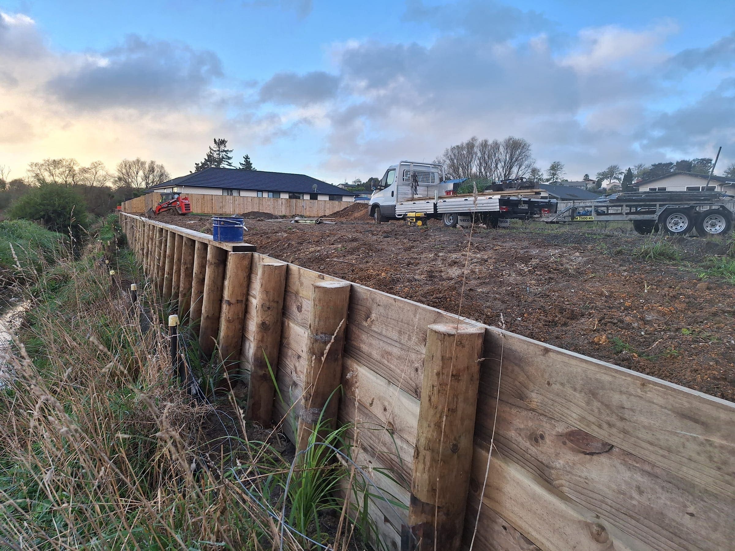Timber retaining wall under construction